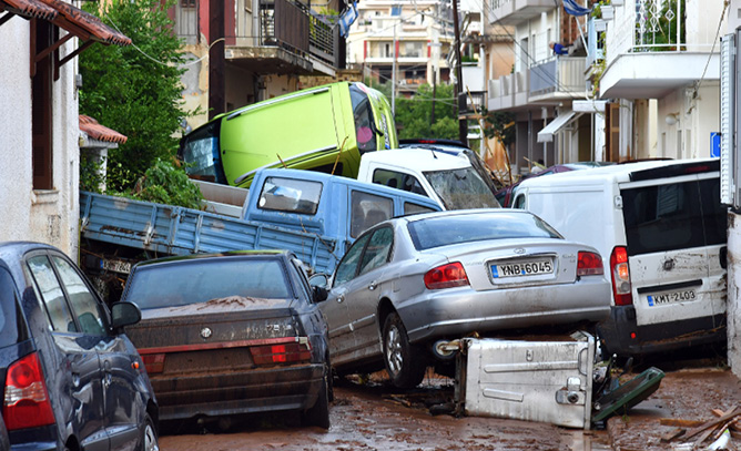 The floods left cars piled up in the streets of Kalamata on 7 September